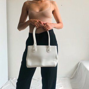 white faux leather purse